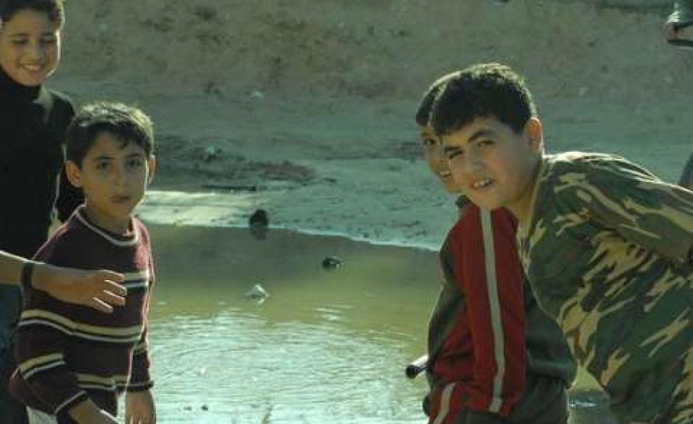 Palestinian boys showing the Free Gaza passengers the lakes of untreated sewerage inside Gaza. Photo: Free Gaza movement via Flickr.