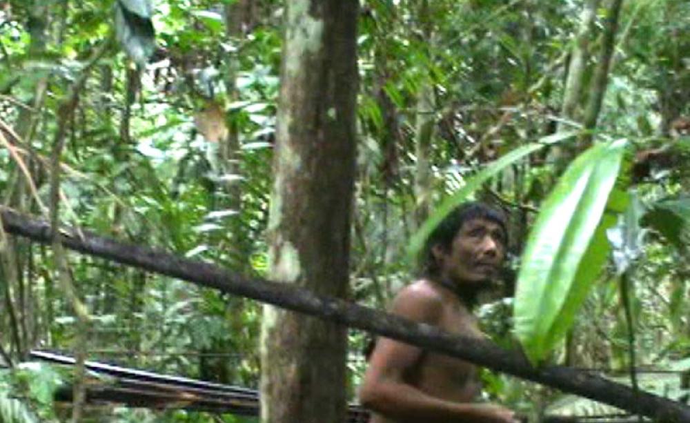Still from video footage taken by a Brazilian government task force during a chance encounter with a Kawahiva tribe member in his rainforest home. Photo: FUNAI.