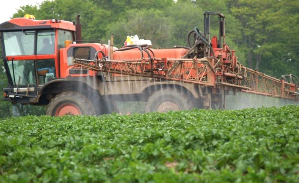 Crop spraying in the British countryside close to a rural resident's home. Spraying of pesticides, including glyphosate, regularly takes place in the locality of homes and gardens with no protection for those living there. Photo: courtesy of UK Pesticides