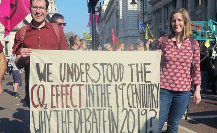 Scott Archer-Nicholls and Caroline Oswald carry a placard at a recent Extinction Rebellion demonstration in London