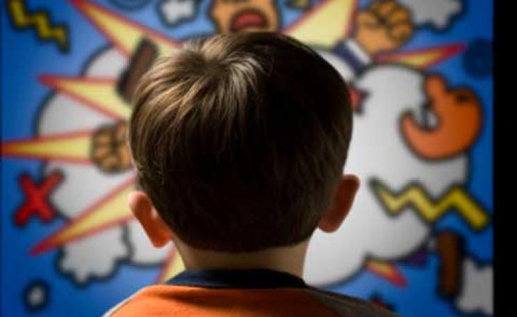 Child in front of a television