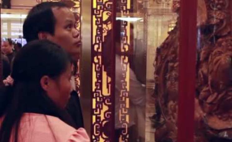 A potential customers at a show of 'hongmu' luxury items made from Siamese rosewood. Photo: EIA.