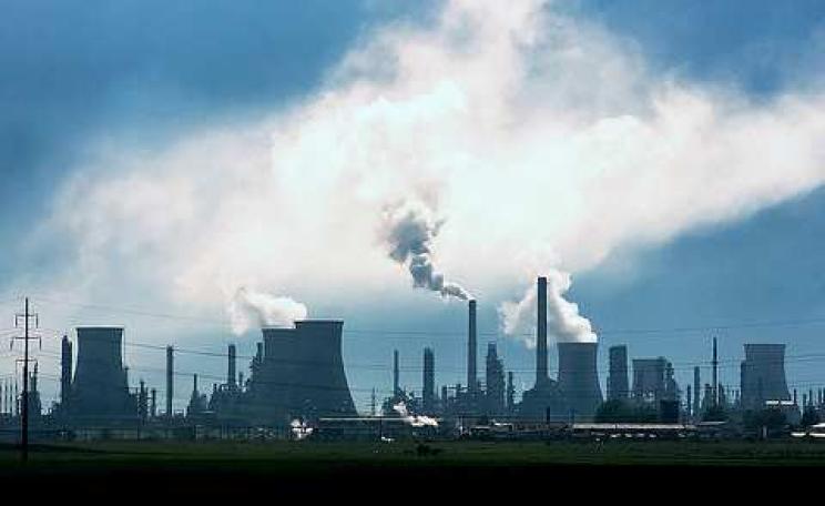 Are oil company valuations as ephemeral as the smoke rising from this oil refinery? Photo: Horia Varlan via Flickr.