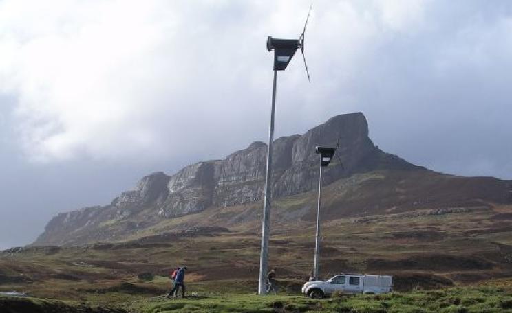 Democratic energy: wind turbines under An Sgurr, Eigg, Scotland. Photo: W. L. Tarbert / Wikimedia Commons.