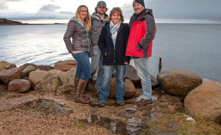 Howard Wood and colleagues in COAST, with the Lamlash Bay 'no take zone' in the background. Photo: COAST.