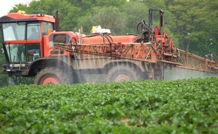 Crop spraying in the British countryside close to a rural resident's home. Spraying of pesticides, including glyphosate, regularly takes place in the locality of homes and gardens with no protection for those living there. Photo: courtesy of UK Pesticides