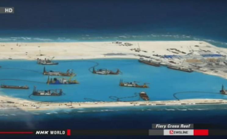 Once a coral reef, now a construction site. China expanding its land 'reclamation' at Fiery Reef in the South China Sea. Photo: still from report by NHK WORLD NEWSLINE English (see video embed).