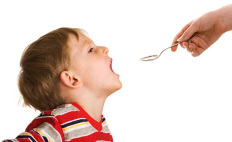 Child taking medicine